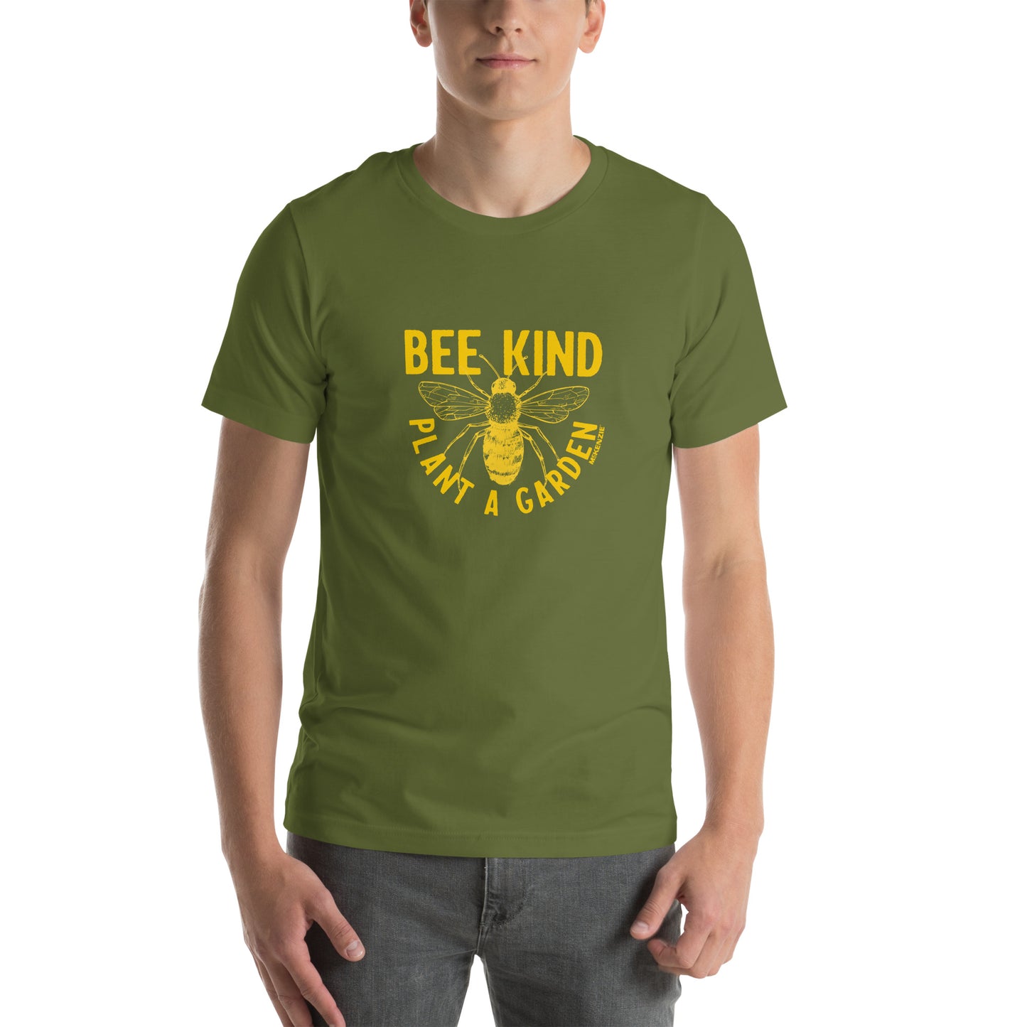 A green olive unisex shirt with a graphic print of a bee, with the text 'BEE KIND' and 'PLANT A GARDEN' on male model