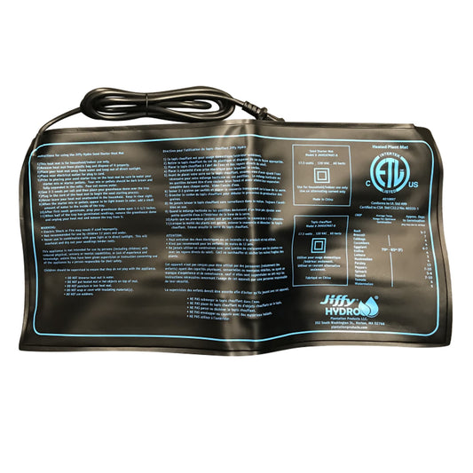 A black Jiffy brand heat mat for seed germination with product information and warnings printed on it.