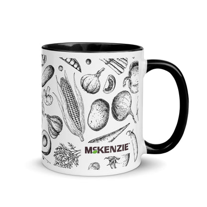 Mug with black handle featuring black and white illustrations of vegetables and the brand 'Mckenzie' on a white background.