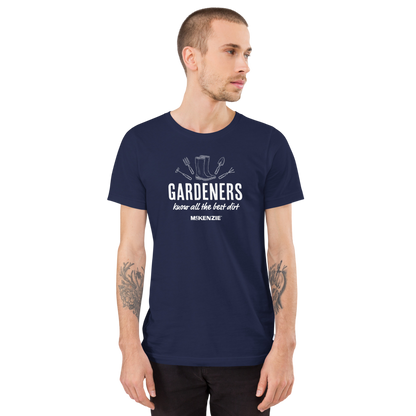 A man wearing a navy blue crewneck t-shirt with a white graphic set against a plain white background.