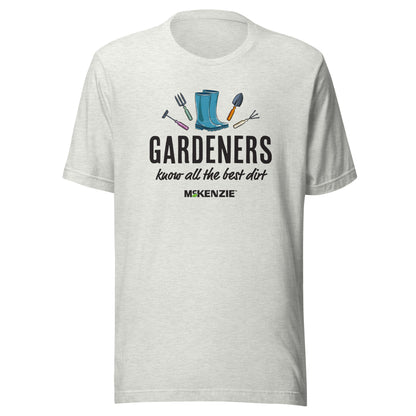 Person wearing a white t-shirt with gardening-themed design and text.