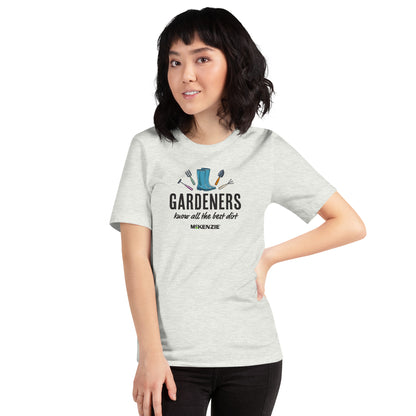 Person wearing a gray t-shirt with a graphic and text on a white background