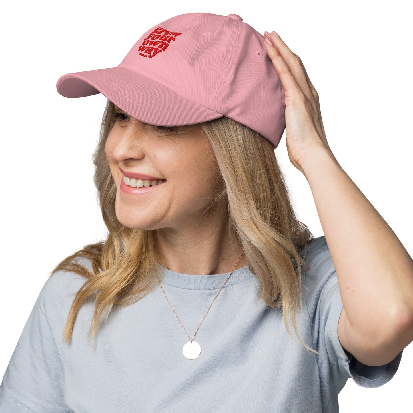 Woman wearing a pink cap with a logo on a white background
