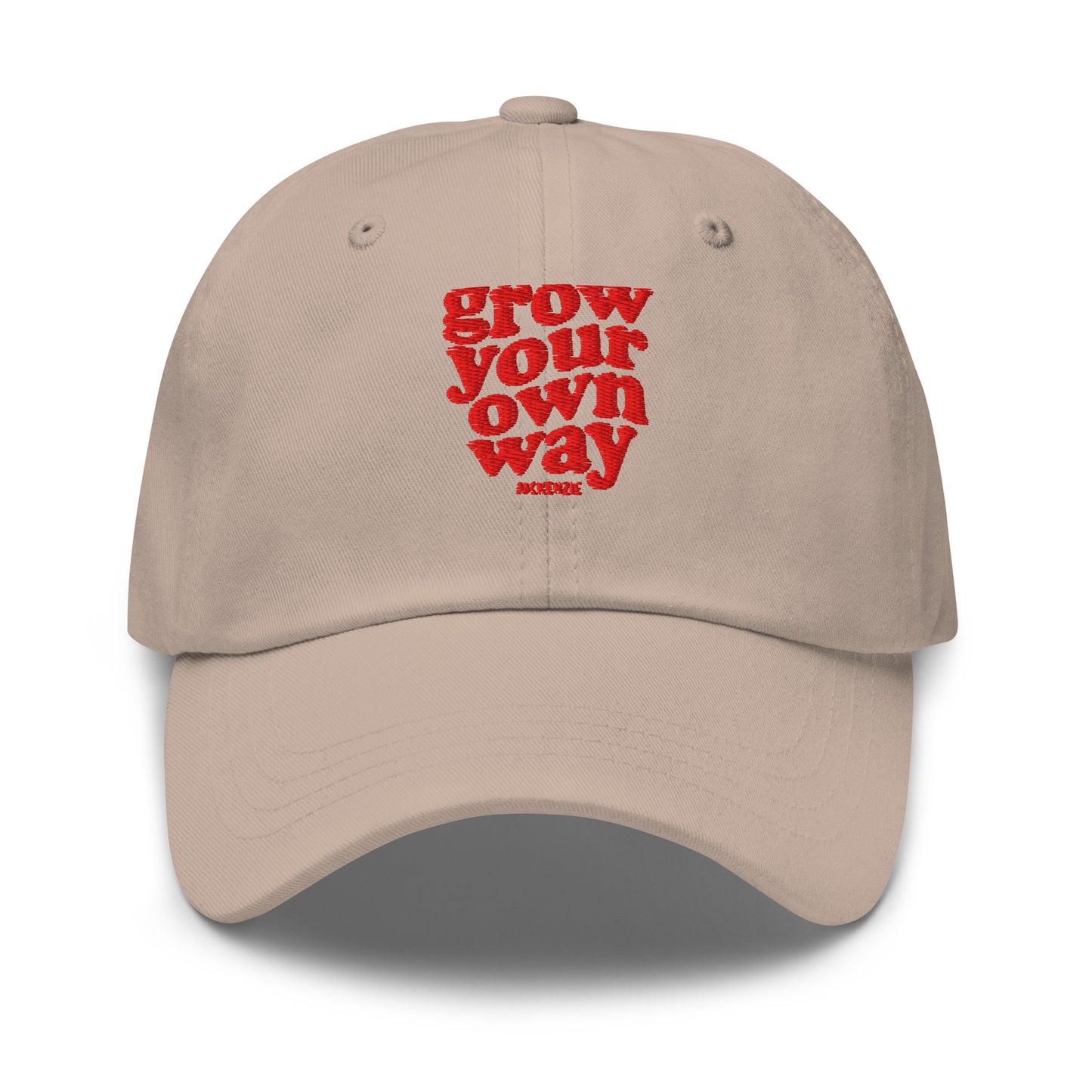 A beige baseball cap with red embroidered text reading on a clean white background.