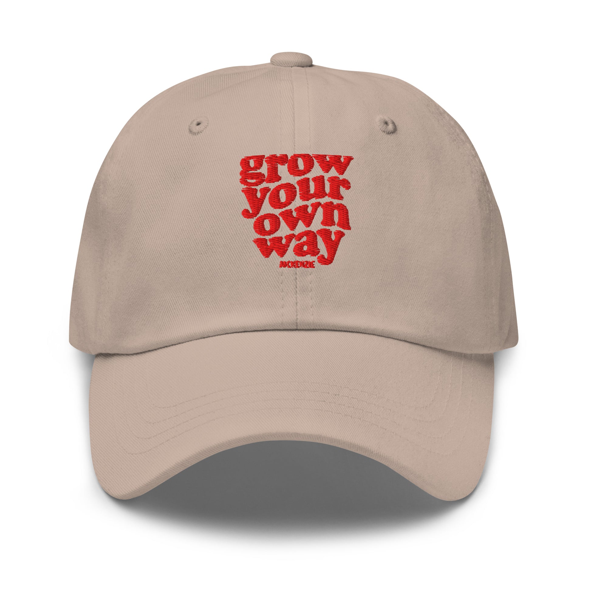 A beige baseball cap with red embroidered text reading on a clean white background.