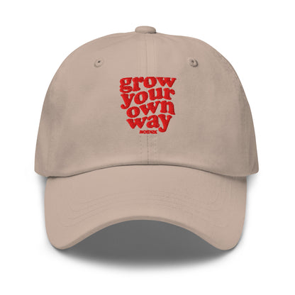 A beige baseball cap with red embroidered text reading on a clean white background.
