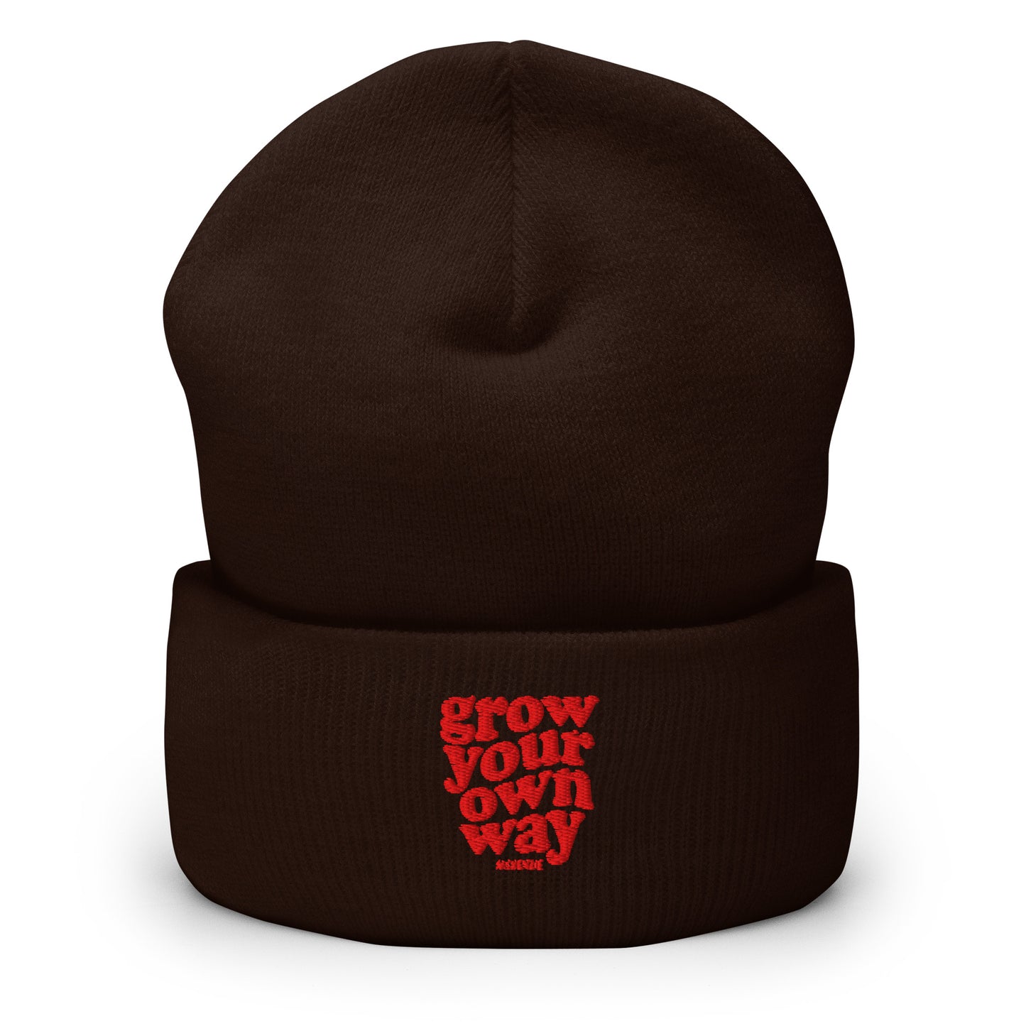A dark brown knit beanie hat with a folded cuff, featuring the phrase 'grow your own way' embroidered in red on the front cuff.