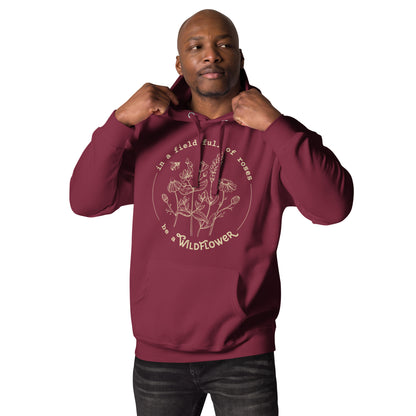 Man wearing a maroon hoodie with floral design and text on a white background
