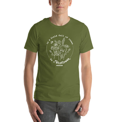 Person wearing a green t-shirt with a floral design and text on a white background