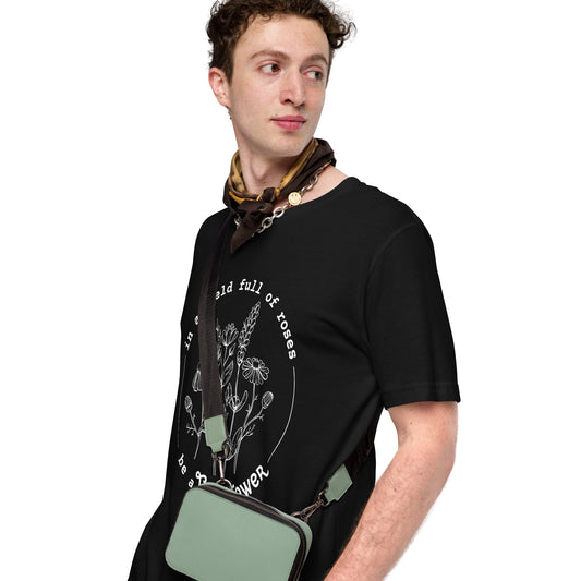 Person wearing a black t-shirt with  print on it against a white background