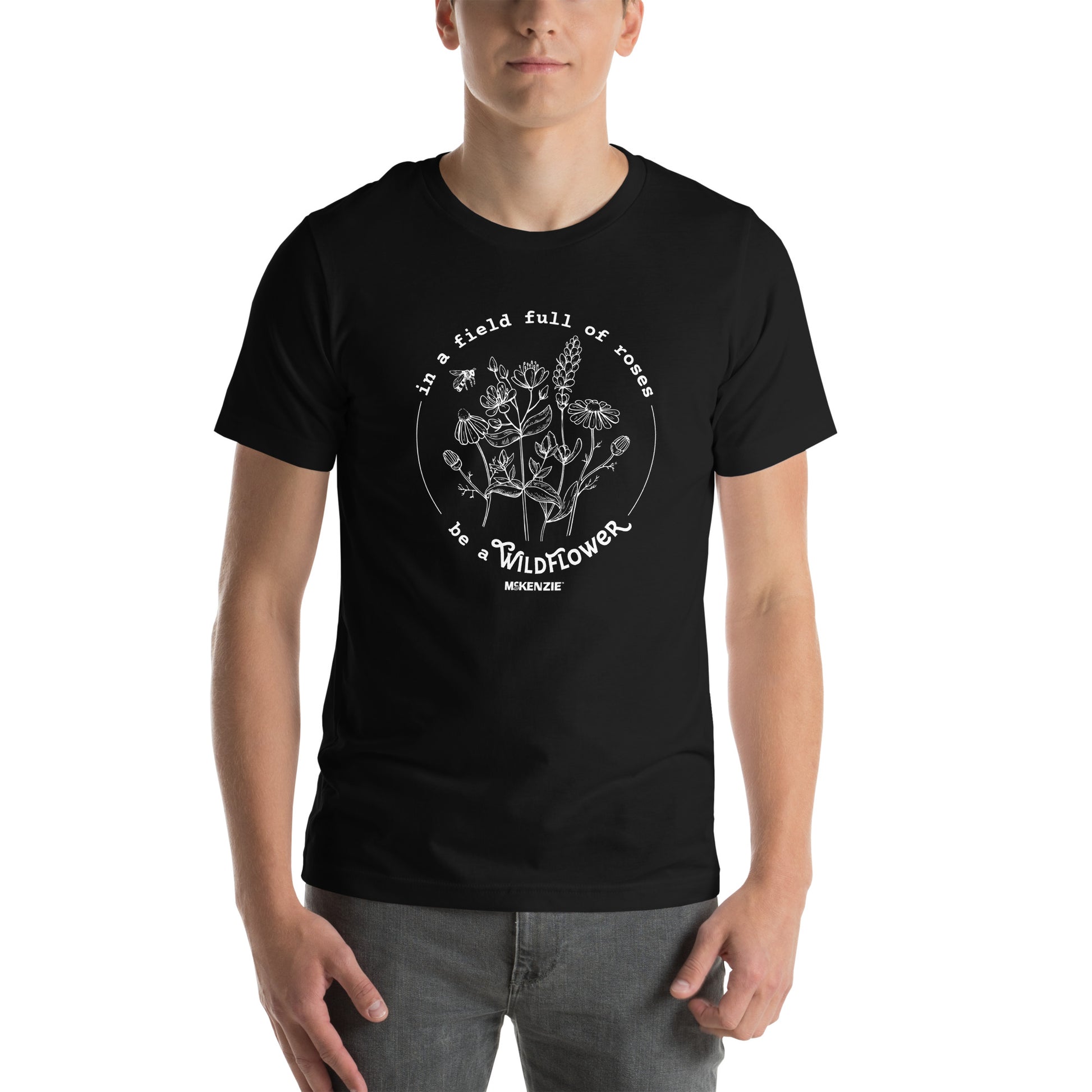 Person wearing a black t-shirt with vintage-style text design on a white background