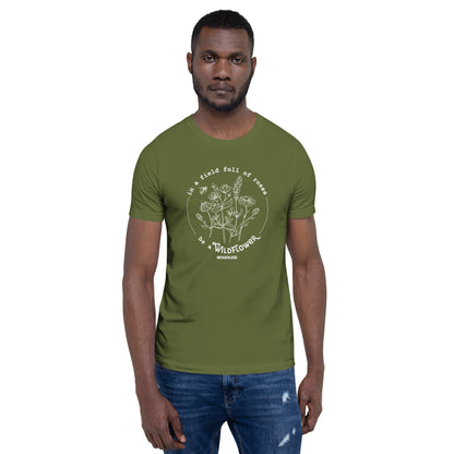 Man wearing a green t-shirt with a white graphic design on a white background