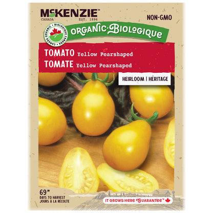 Mckenzie Organic tomato seed packet with yellow pear-shaped tomatoes on a wooden surface.