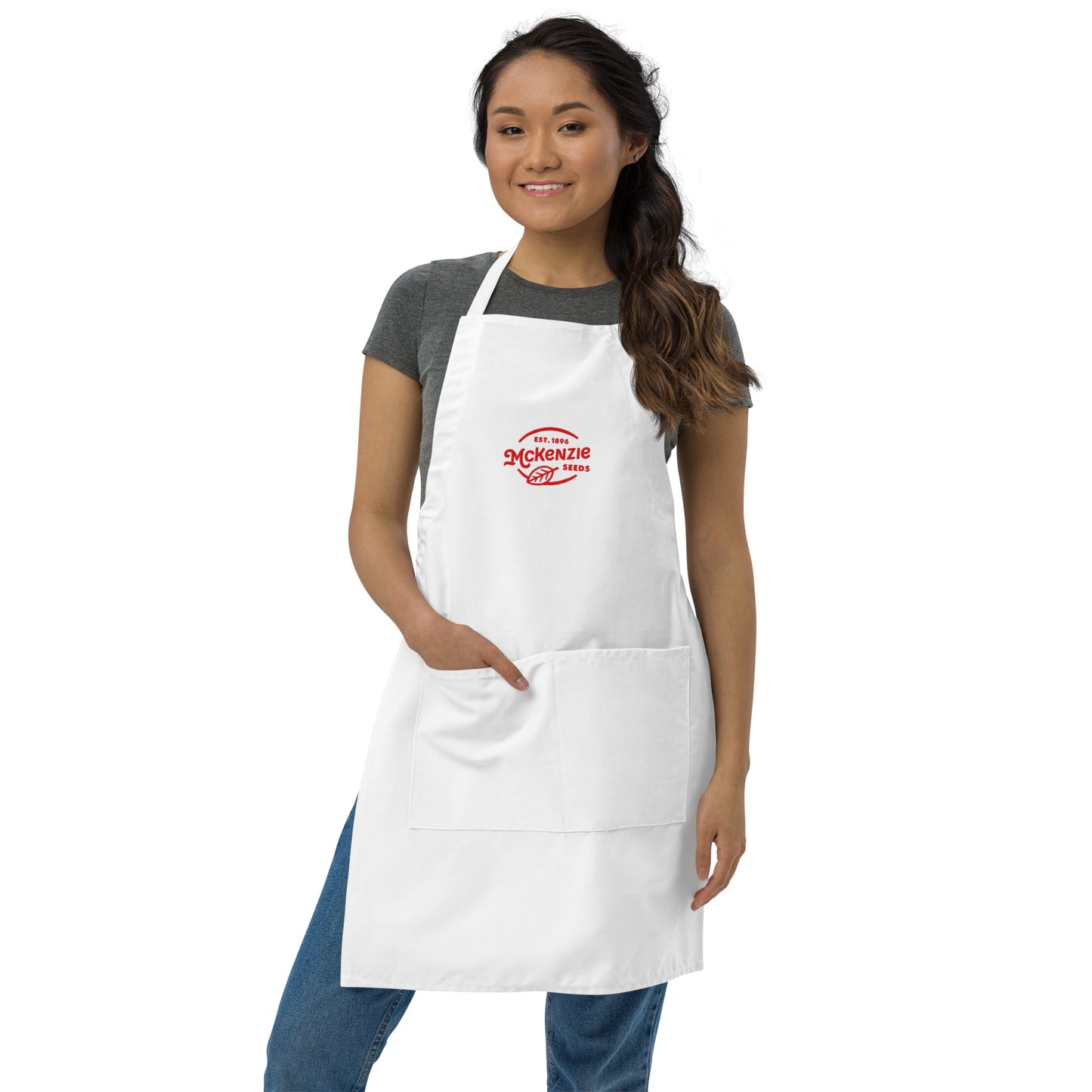 Woman wearing a white apron with a logo on a white background