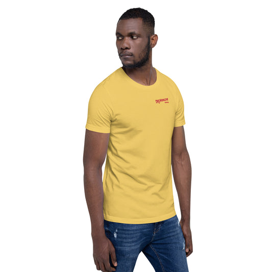 Man wearing a yellow t-shirt with a red logo and text saying "McKenzie Seeds" on a white background