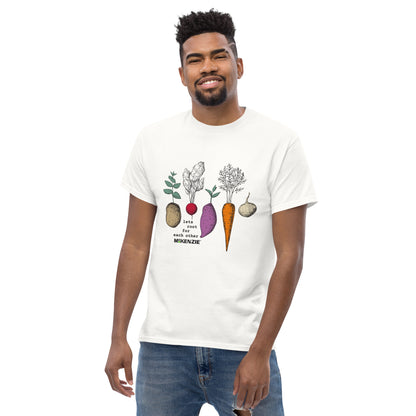 Man wearing a white t-shirt with vegetable graphics on a white background